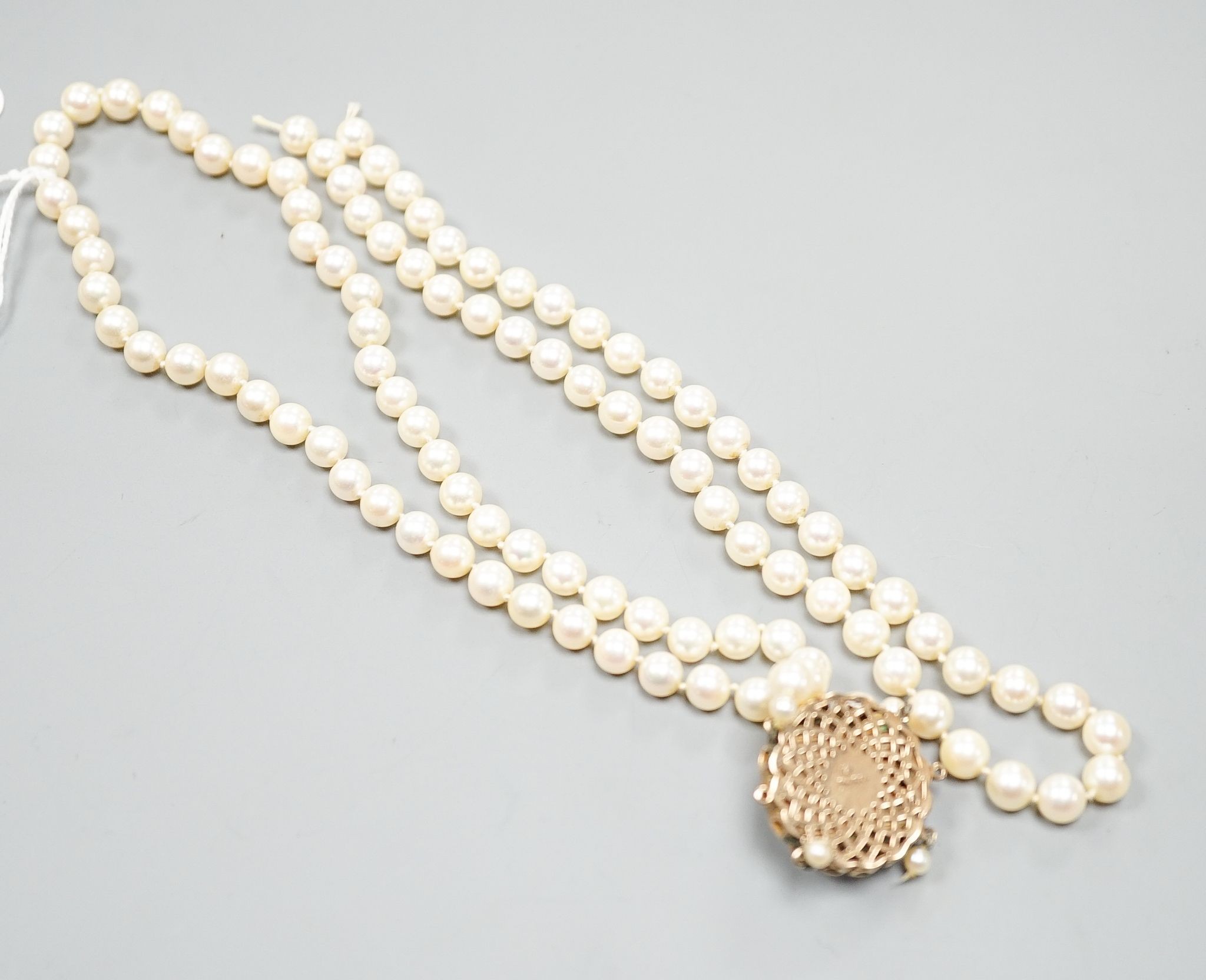 A 1960's double strand cultured pearl necklace, with 9ct gold, amethyst and cultured pearl set clasp (a.f.), approx. 40cm